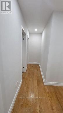Whitby (Taunton North) apartment for rent - A long hallway with wood floors and white walls.