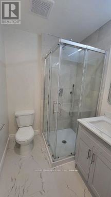 Whitby (Taunton North) apartment for rent - A white toilet sits next to a walk-in shower in a bathroom.