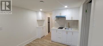 Aurora (Aurora Highlands) apartment for rent - A white kitchen with a sink and cabinets.