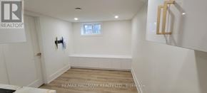Aurora (Aurora Highlands) apartment for rent - A white bathroom with a window and a wooden frame on the wall.