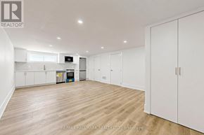 Aurora (Aurora Highlands) apartment for rent - A white bedroom with a wood floor and a white closet.