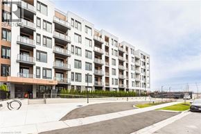 Milton condo for rent - A modern apartment building with the number 1440 on the front.