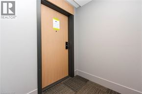 Milton condo for rent - A door with a sign on it in a hallway.