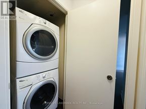 Toronto (Agincourt South-Malvern West) condo for rent - A stack of white front loading washing machines in a small room.