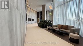 Vaughan (Steeles West Industrial) condo for rent - A modern living room with a large window and a couch.