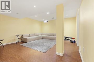 Oakville townhouse for rent - A living room with a grey rug and a sofa.