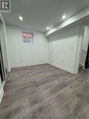Milton (Co Coates) apartment for rent - A room with wooden flooring and white walls.