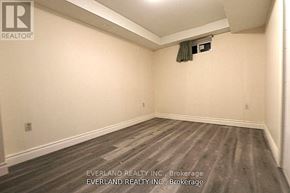 Toronto (Agincourt North) apartment for rent - A room with Everland Realty Inc. written on the wall.