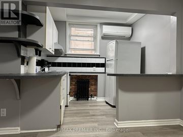 Toronto (Woodbine-Lumsden) multi-family for rent - A kitchen with a refrigerator, stove, and oven.