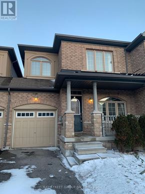 Markham (Wismer) townhouse for rent - A house with a garage and a bay window.