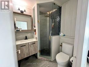 Toronto (Regent Park) condo for rent - A bathroom with a toilet, sink, and shower.
