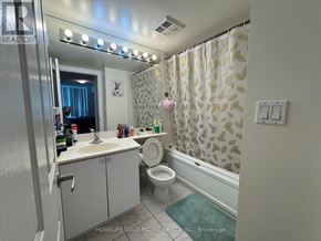 Toronto (Woburn) condo for rent - A bathroom with a sink, toilet, and bathtub.