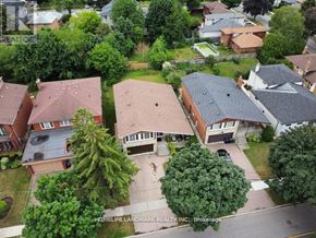 Toronto (Newtonbrook West) apartment for rent - A bird's eye view of a residential neighborhood with houses and trees.