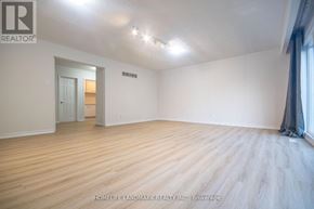 Toronto (Newtonbrook West) apartment for rent - A room with wooden flooring and a white door.