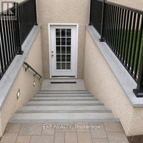 Toronto (Danforth Village-East York) apartment for rent - A white door is at the end of a staircase.