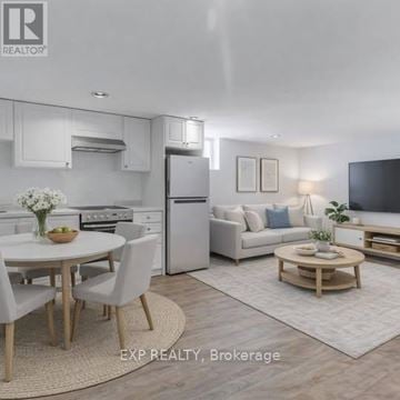 Toronto (Danforth Village-East York) apartment for rent - A modern kitchen with white appliances and a dining table set for four.