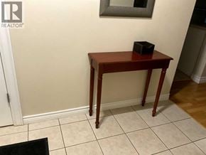 Lloydminster apartment for rent - A small wooden table with a black box on it.