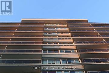 Toronto (Yonge-St. Clair) house for rent - A tall building with the words EXP REALTY Brokerage on the bottom.