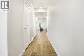 Chatham townhouse for rent - A long hallway with a brown rug on the floor.