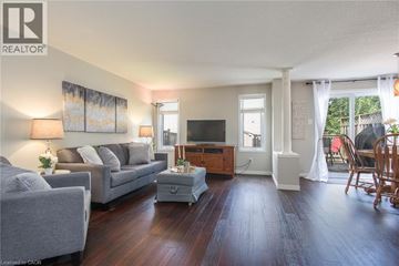 Waterloo apartment for rent - A living room with a grey couch and a wooden coffee table.