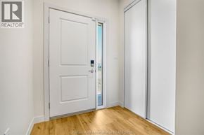 Chatham townhouse for rent - A white door is open to a hallway.
