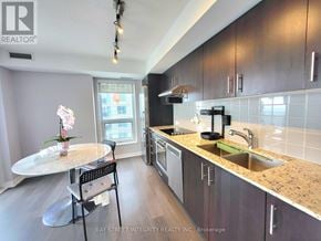 Toronto (Agincourt South-Malvern West) condo for rent - A kitchen with a table and chairs in front of a window.