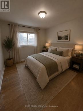 Toronto (Humbermede) apartment for rent - A bedroom with a large bed and a window with curtains.