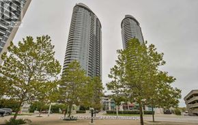 Toronto (Agincourt South-Malvern West) condo for rent - Two tall buildings are surrounded by trees and have a sign that says "Royal LePage Signature Realty Brokerage.".