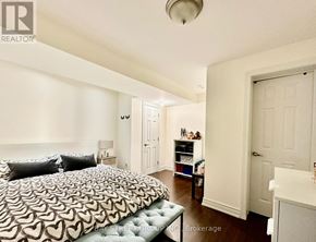 Richmond Hill (Oak Ridges Lake Wilcox) apartment for rent - A bedroom with a bed, nightstand, and a dresser.