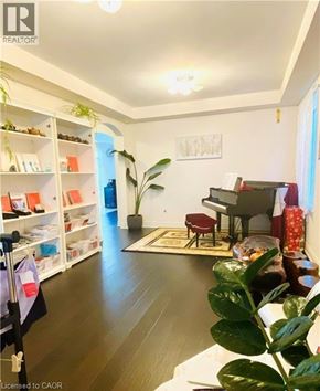 Hamilton apartment for rent - A living room with a piano and a potted plant.