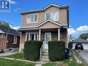 Toronto (Woodbine-Lumsden) apartment for rent - A house with a white door and windows is for sale.