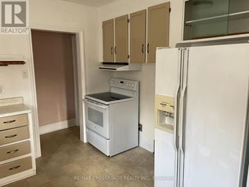 Toronto (Woodbine-Lumsden) apartment for rent - A kitchen with a white fridge, white oven and white microwave.
