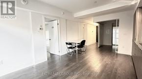 Toronto (Bay Street Corridor) condo for rent - A spacious room with a dining table and chairs.