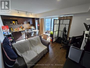 Toronto (Agincourt South-Malvern West) condo for rent - A living room with a couch and a dining table.
