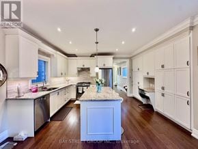 Mississauga (Lakeview) apartment for rent - A kitchen with white cabinets and a granite island.