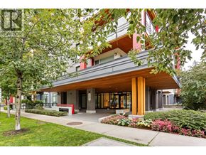 Vancouver apartment for rent - A modern building with a red roof and a glass entrance.