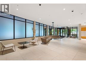 Vancouver apartment for rent - A large, modern lobby with a reception desk and seating area.