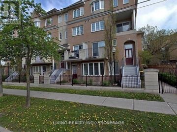 Toronto (Willowdale East) townhouse for rent - Apartment building with a tree in front of it.
