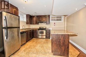 Toronto (Highland Creek) apartment for rent - A kitchen with a refrigerator, oven, and cabinets.