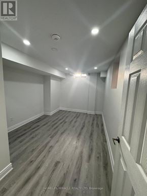 Halton Hills (Georgetown) apartment for rent - A hallway with wood flooring and white walls.