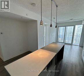 Toronto (Waterfront Communities) condo for rent - A white room with a long table and a window.