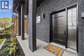 Hamilton apartment for rent - A black door with a glass window and a welcome mat in front of it.