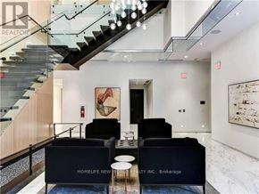 Toronto (Mount Pleasant West) condo for rent - A modern living room with a staircase and a couch that says "Homelife New".