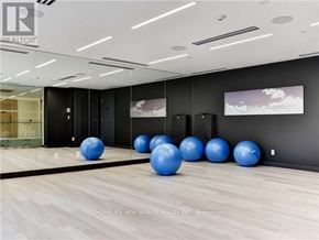 Toronto (Mount Pleasant West) condo for rent - A room with a grey wall and a row of blue exercise balls.