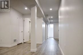 Markham (Cedar Grove) apartment for rent - A long hallway with white walls and wood flooring.