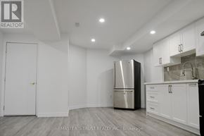 Markham (Cedar Grove) apartment for rent - A kitchen with a refrigerator, cabinets, and a counter.