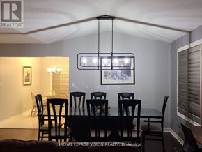 Niagara Falls (Ascot) apartment for rent - A dining room with a table set for six.