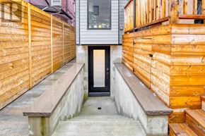 Toronto (Dovercourt-Wallace Emerson-Junction) apartment for rent - A wooden fence and steps lead to a glass door.