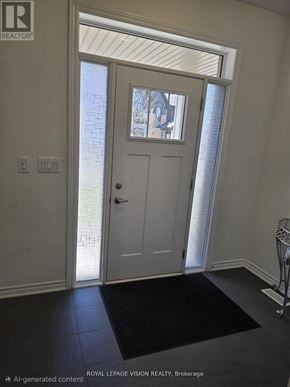 Whitby (Rolling Acres) apartment for rent - A white door with a glass window is in a room with a black mat on the floor.