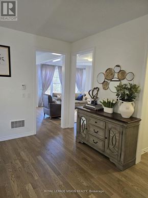 Whitby (Rolling Acres) apartment for rent - A room with a wooden floor and a cabinet with drawers.